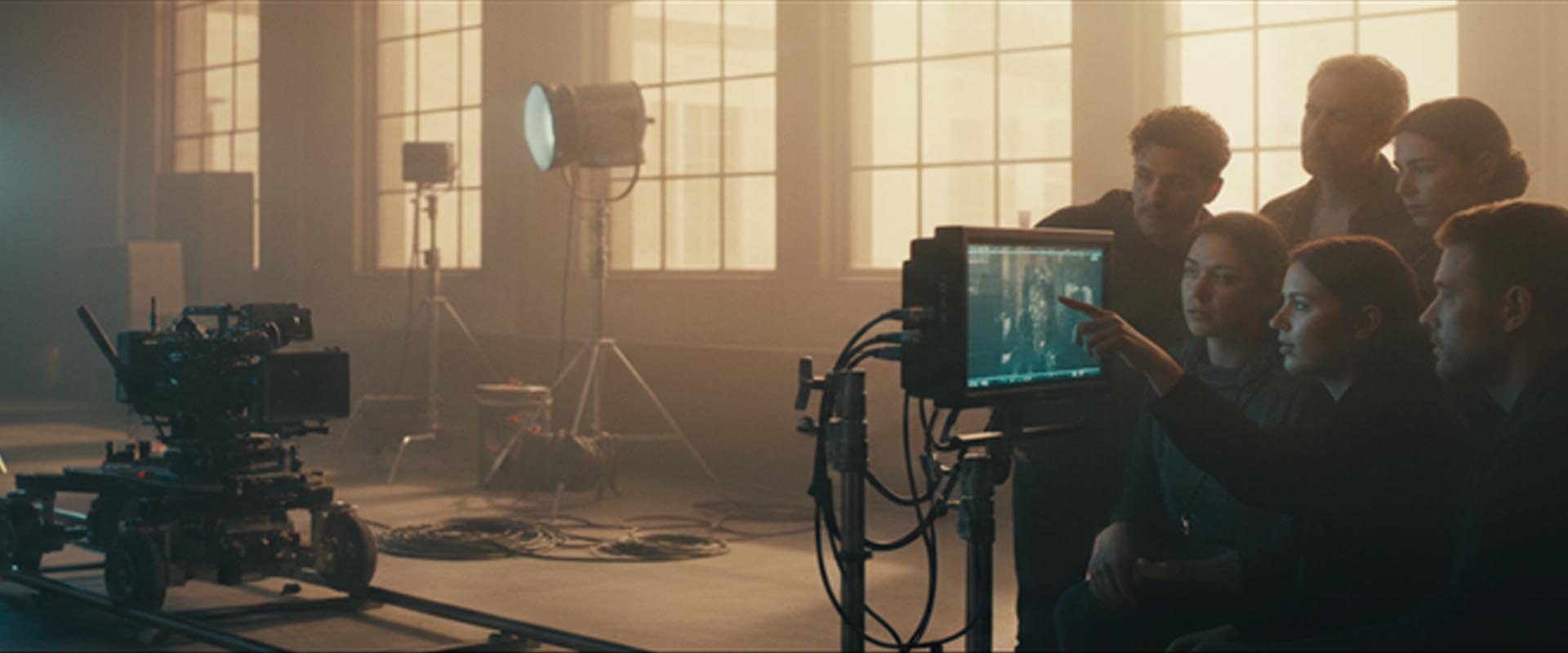 Film crew collaborating on set